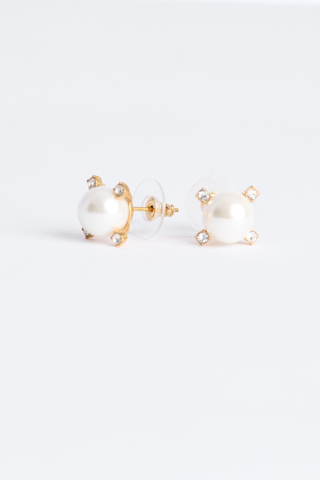 Pair of pearl earrings on a white background
